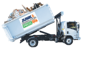 JUnk-Dumpster-Truck Junk & Demolition Pros LLC’s heavy-duty dumpster truck in action - loading construction debris for fast, eco-friendly disposal
