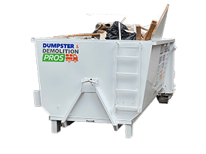 Order-Junk-Dumpster Junk & Demolition Pros LLC's 20-yard roll-off dumpster being delivered to a residential driveway for renovation cleanout