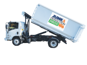Dumpster-Truck Junk & Demolition Pros LLC's heavy-duty dumpster truck unloading a 30-yard container at a construction site - reliable commercial debris removal in action