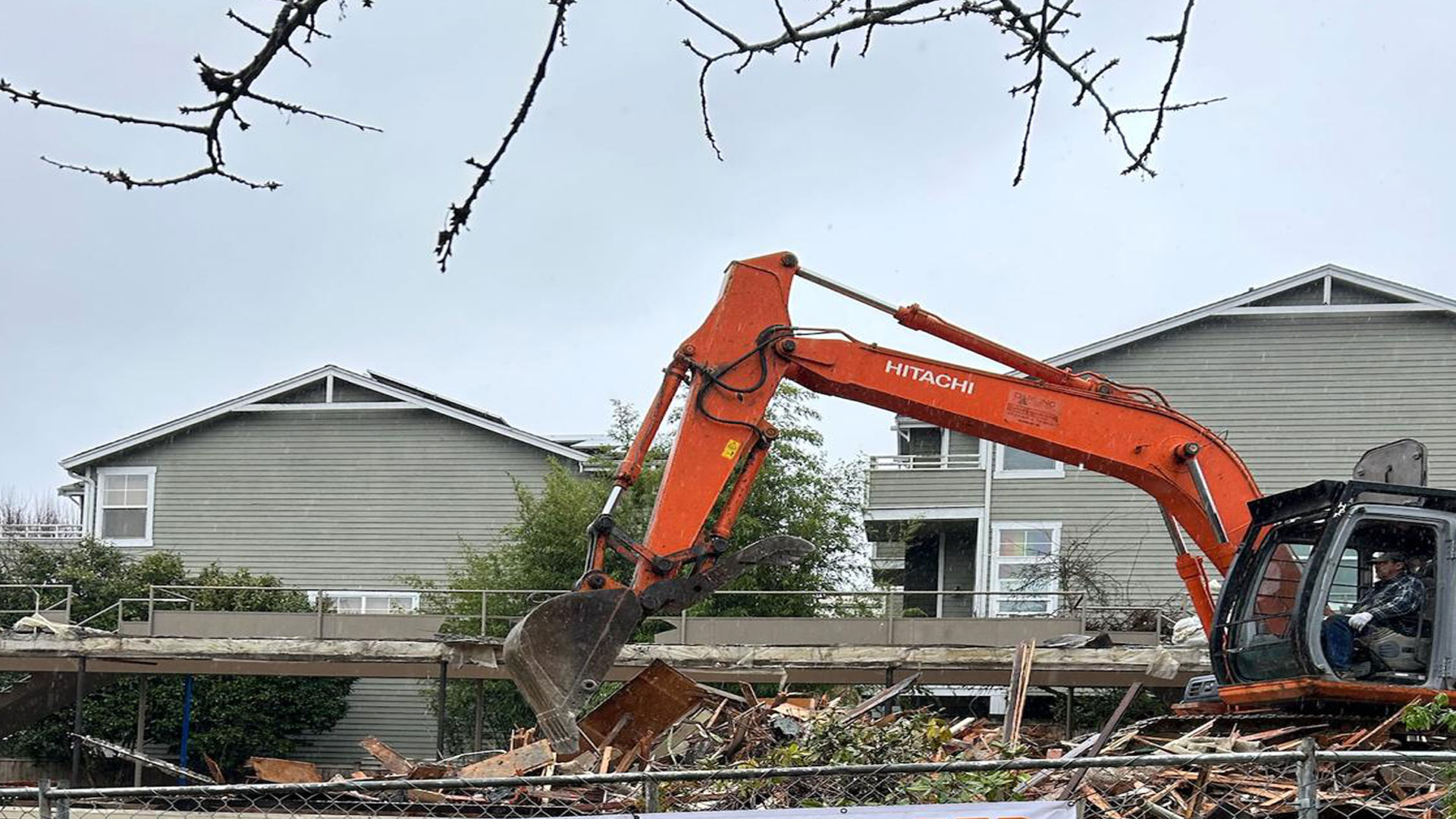 Junk & Demolition Pros LLC demolition service infographic featuring J Pro mascot with icons representing safe and professional residential and commercial demolition.