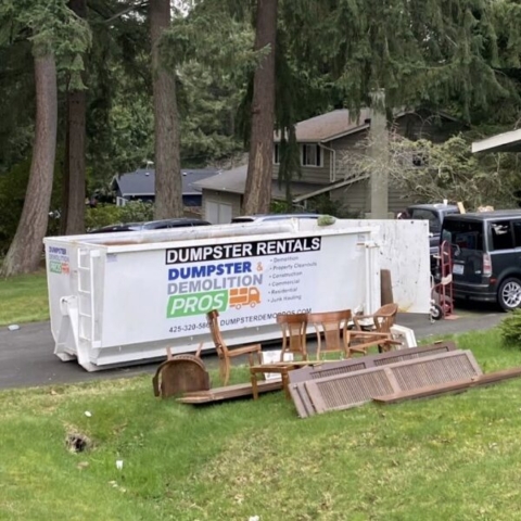 Dumpster in a driveway.
