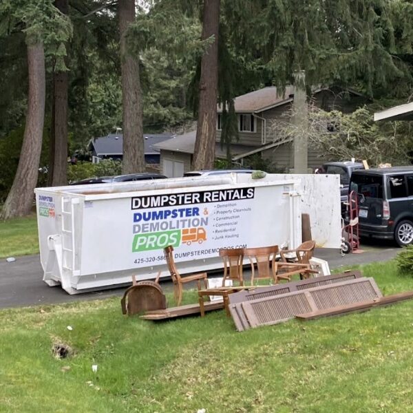 Dumpster in a driveway.