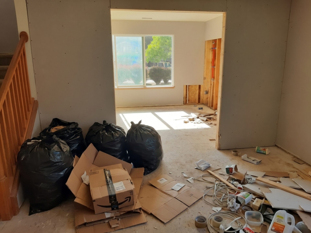 Patio before and after junk removal, with the furniture and clutter cleared