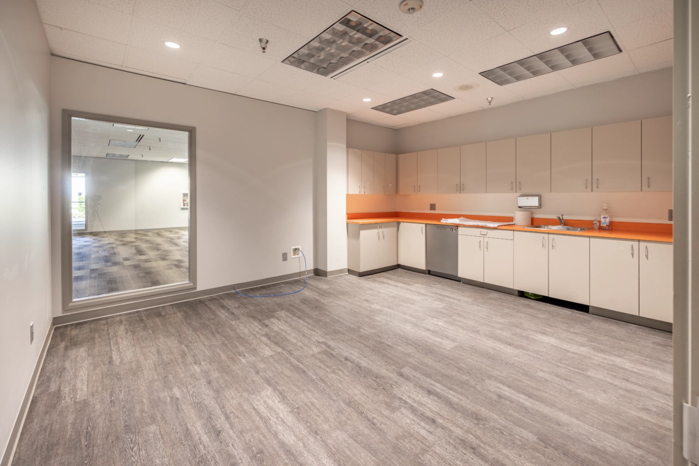 Empty commercial office suite with a kitchenette