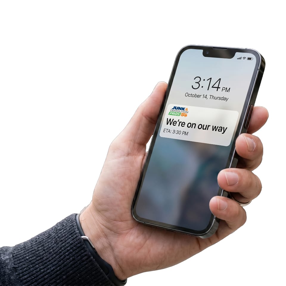 A person getting confirmation on their phone of scheduled junk removal service.