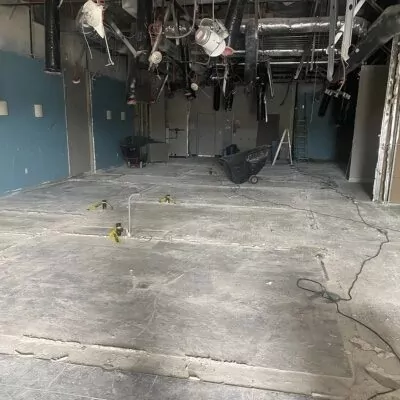 Commercial interior cleared to the concrete floor after selective demolition