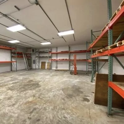 The same warehouse after the cleanout, with the floor cleared